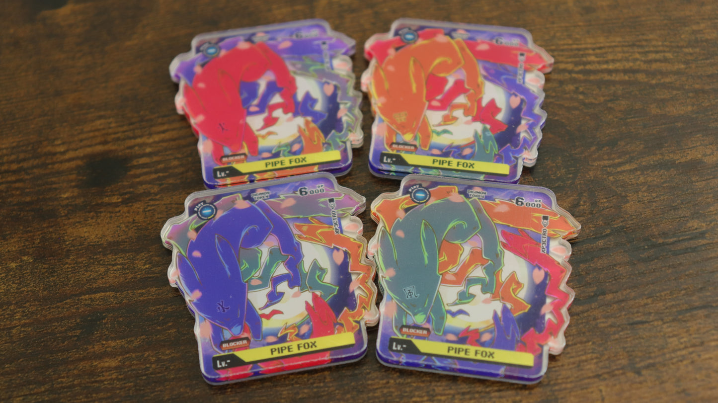 Pipe Fox acrylic token set for the Digimon Card Game, shown in a product photo with four color variants used with the Sakuyamon playmat theme.