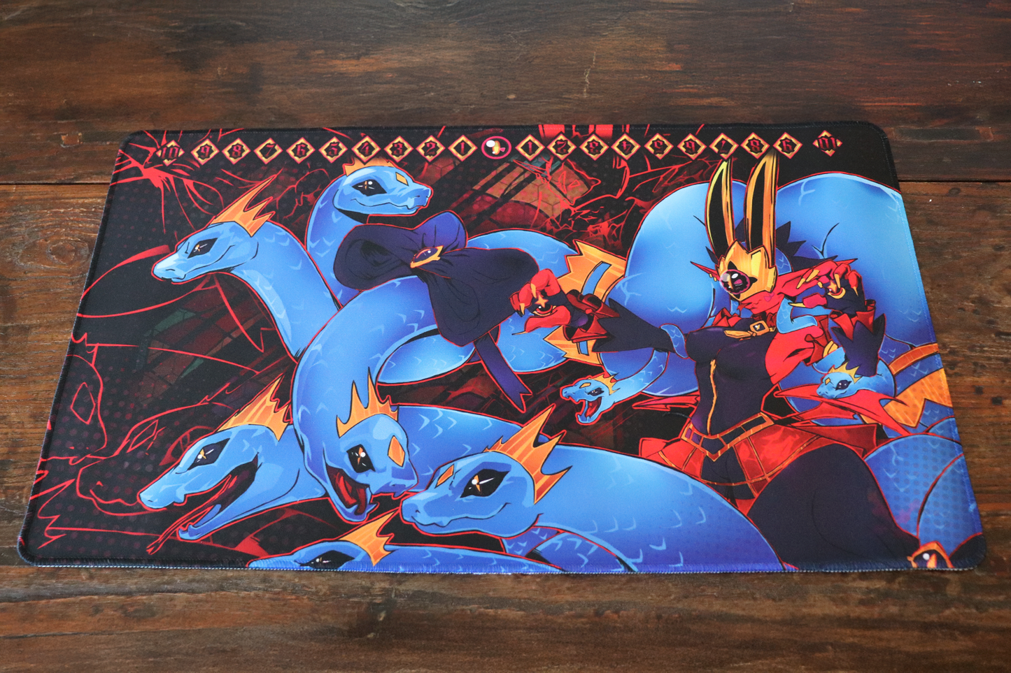 Digimon Card Game playmat artwork featuring Medusamon in a dark red and black gorgon theme with multiple blue serpent heads, bold character pose, and a memory gauge counter with a eye icon across the top.